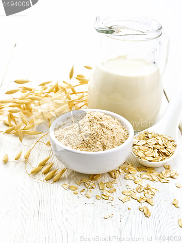 Image of Flour oat in bowl with milk on light board