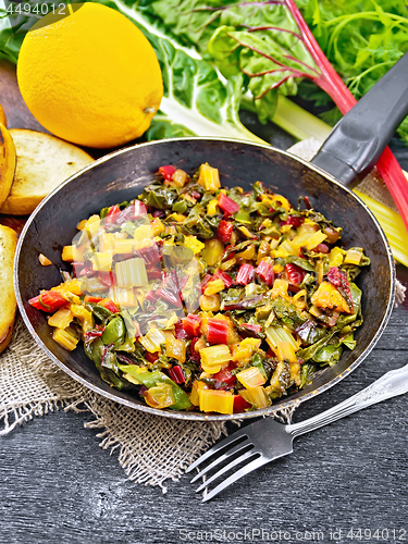 Image of Mangold braised in pan on wooden board