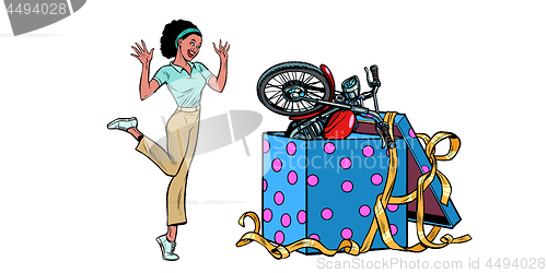 Image of motorcycle holiday gift box. African woman funny reaction isolate on white background