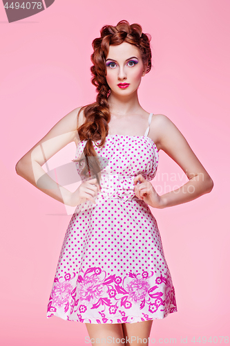 Image of Beautiful girl in dress with braided hair