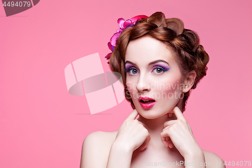 Image of Beautiful girl with bright make-up and pink hat