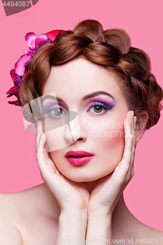 Image of Beautiful girl with bright make-up and pink hat