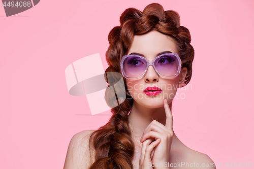Image of Beautiful girl with bright make-up and sunglasses