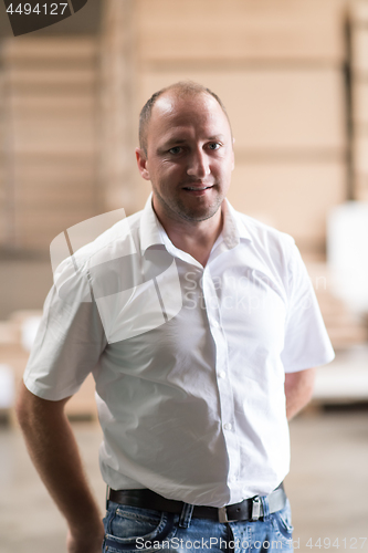 Image of designer in his furniture manufacturing workshop