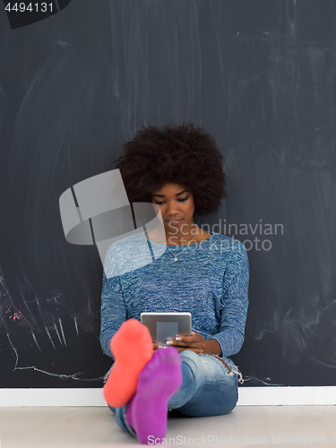 Image of Happy African American Woman Using Digital Tablet