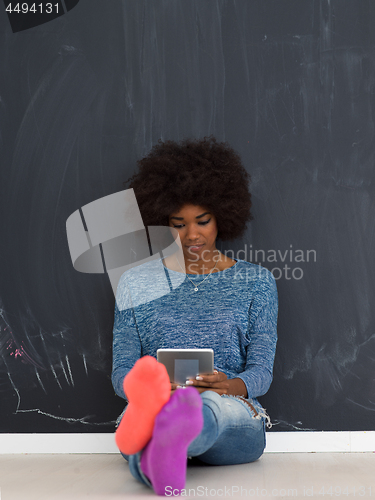 Image of Happy African American Woman Using Digital Tablet