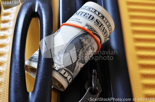 Image of Suitcase with US Dollar banknotes