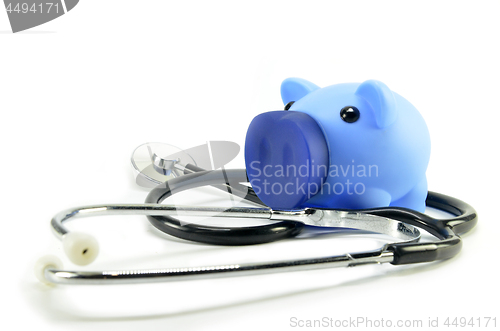 Image of Stethoscope and piggy bank