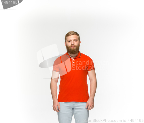 Image of Closeup of young man\'s body in empty red t-shirt isolated on white background. Mock up for disign concept