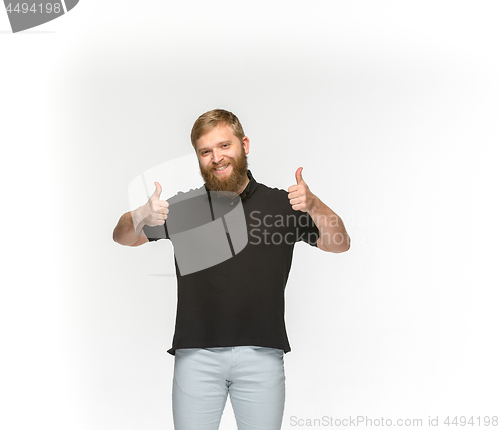 Image of Closeup of young man\'s body in empty black t-shirt isolated on white background. Mock up for disign concept