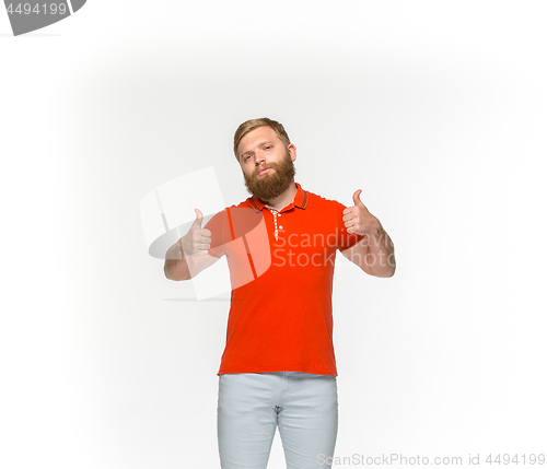 Image of Closeup of young man\'s body in empty red t-shirt isolated on white background. Mock up for disign concept