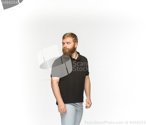 Image of Closeup of young man\'s body in empty black t-shirt isolated on white background. Mock up for disign concept