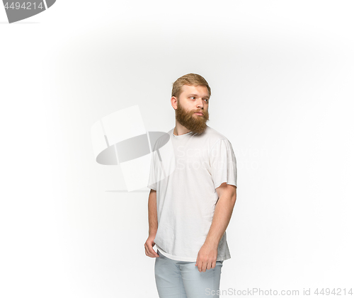 Image of Closeup of young man\'s body in empty white t-shirt isolated on white background. Mock up for disign concept