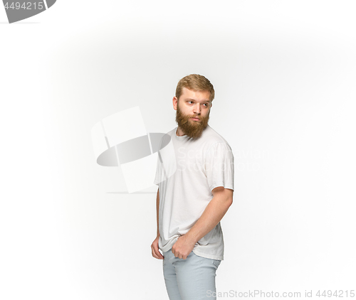 Image of Closeup of young man\'s body in empty white t-shirt isolated on white background. Mock up for disign concept