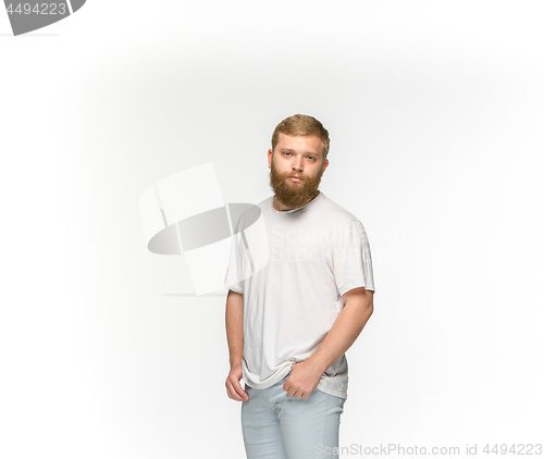 Image of Closeup of young man\'s body in empty white t-shirt isolated on white background. Mock up for disign concept