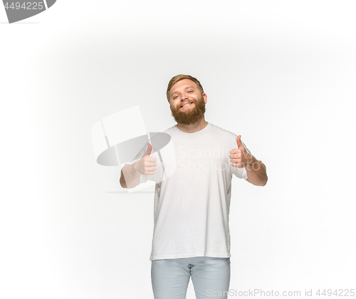 Image of Closeup of young man\'s body in empty white t-shirt isolated on white background. Mock up for disign concept