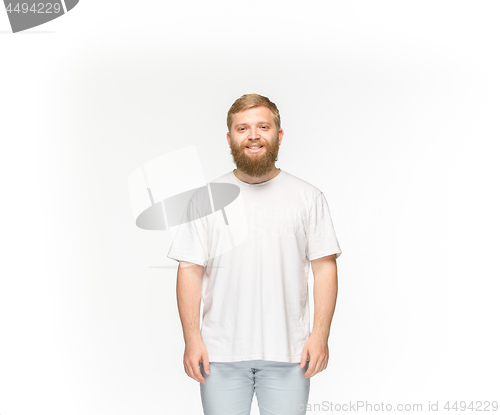 Image of Closeup of young man\'s body in empty white t-shirt isolated on white background. Mock up for disign concept