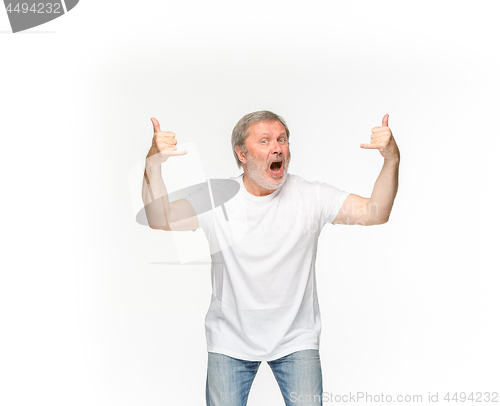 Image of Closeup of senior man\'s body in empty white t-shirt isolated on white background. Mock up for disign concept