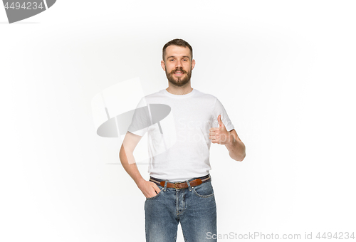 Image of Closeup of young man\'s body in empty white t-shirt isolated on white background. Mock up for disign concept