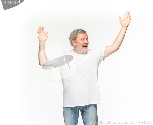 Image of Closeup of senior man\'s body in empty white t-shirt isolated on white background. Mock up for disign concept