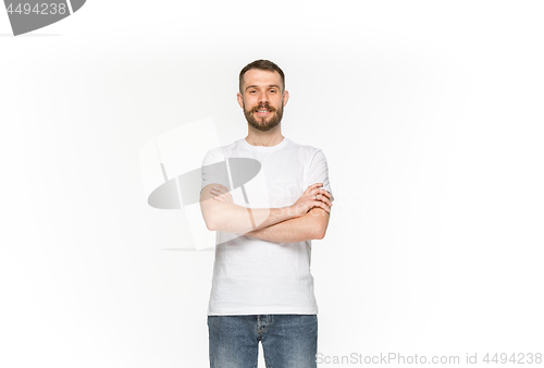 Image of Closeup of young man\'s body in empty white t-shirt isolated on white background. Mock up for disign concept