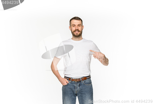 Image of Closeup of young man\'s body in empty white t-shirt isolated on white background. Mock up for disign concept