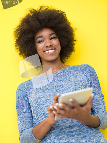 Image of young black Woman Using Digital Tablet