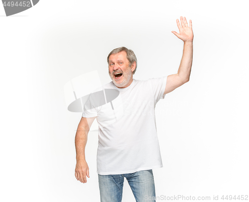 Image of Closeup of senior man\'s body in empty white t-shirt isolated on white background. Mock up for disign concept