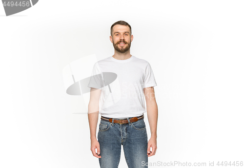 Image of Closeup of young man\'s body in empty white t-shirt isolated on white background. Mock up for disign concept