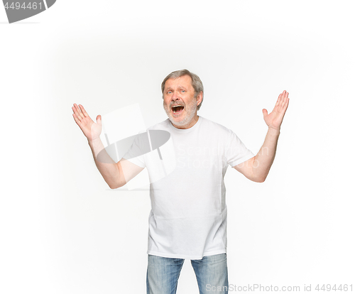 Image of Closeup of senior man\'s body in empty white t-shirt isolated on white background. Mock up for disign concept