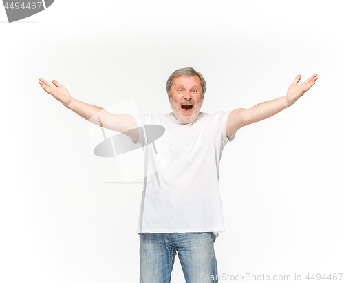 Image of Closeup of senior man\'s body in empty white t-shirt isolated on white background. Mock up for disign concept