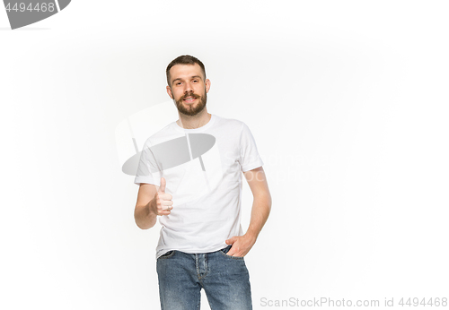 Image of Closeup of young man\'s body in empty white t-shirt isolated on white background. Mock up for disign concept