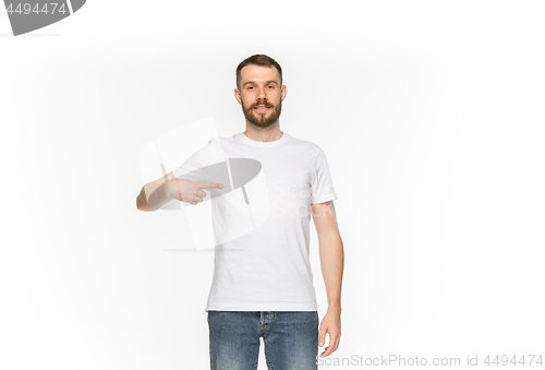 Image of Closeup of young man\'s body in empty white t-shirt isolated on white background. Mock up for disign concept