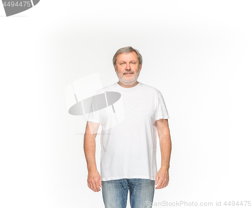 Image of Closeup of senior man\'s body in empty white t-shirt isolated on white background. Mock up for disign concept