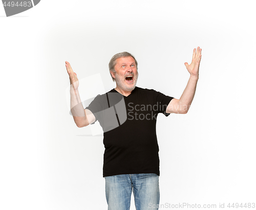 Image of Closeup of senior man\'s body in empty black t-shirt isolated on white background. Mock up for disign concept