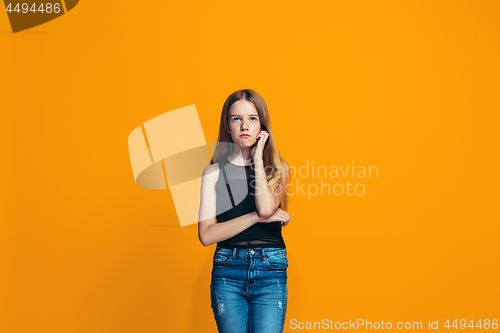 Image of Young serious thoughtful teen girl. Doubt concept.