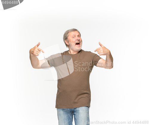 Image of Closeup of senior man\'s body in empty brown t-shirt isolated on white background. Mock up for disign concept
