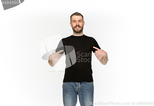 Image of Closeup of young man\'s body in empty black t-shirt isolated on white background. Mock up for disign concept