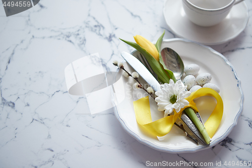 Image of Spring Easter Table setting at white marble table. Top view