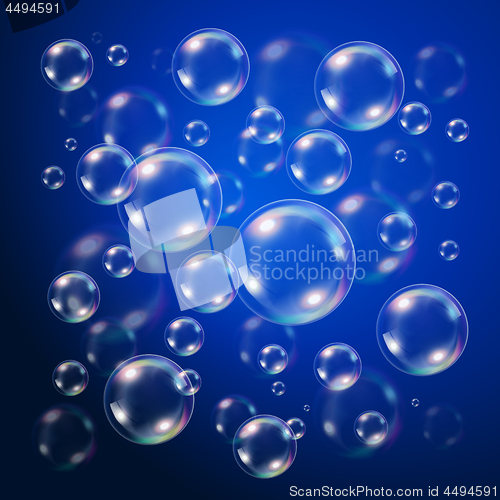 Image of Transparent bubbles over dark blue