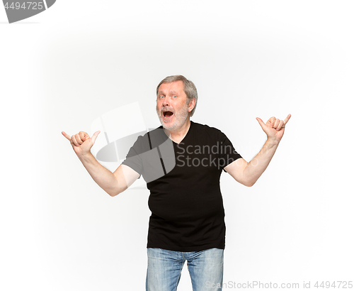 Image of Closeup of senior man\'s body in empty black t-shirt isolated on white background. Mock up for disign concept