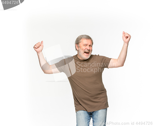 Image of Closeup of senior man\'s body in empty brown t-shirt isolated on white background. Mock up for disign concept