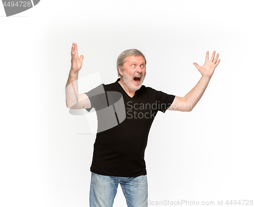 Image of Closeup of senior man\'s body in empty black t-shirt isolated on white background. Mock up for disign concept
