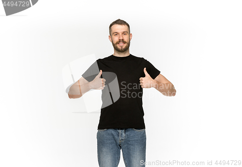 Image of Closeup of young man\'s body in empty black t-shirt isolated on white background. Mock up for disign concept