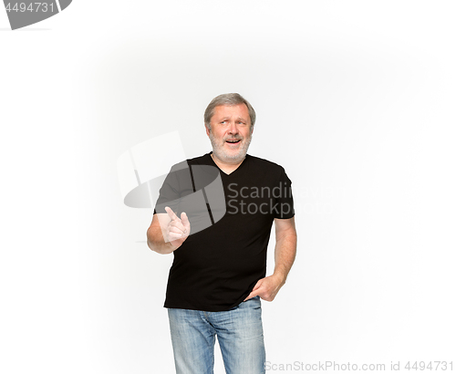 Image of Closeup of senior man\'s body in empty black t-shirt isolated on white background. Mock up for disign concept