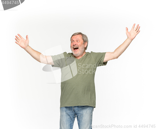 Image of Closeup of senior man\'s body in empty green t-shirt isolated on white background. Mock up for disign concept