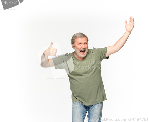 Image of Closeup of senior man\'s body in empty green t-shirt isolated on white background. Mock up for disign concept