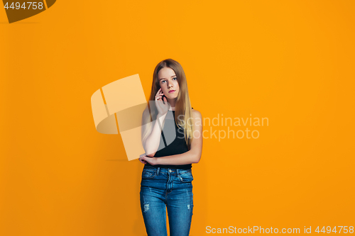 Image of Young serious thoughtful teen girl. Doubt concept.