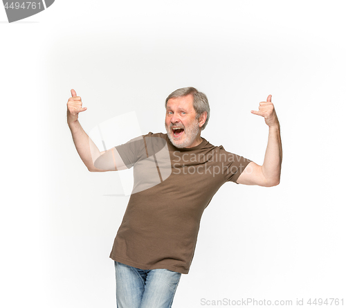 Image of Closeup of senior man\'s body in empty brown t-shirt isolated on white background. Mock up for disign concept