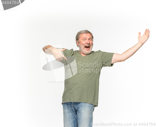 Image of Closeup of senior man\'s body in empty green t-shirt isolated on white background. Mock up for disign concept